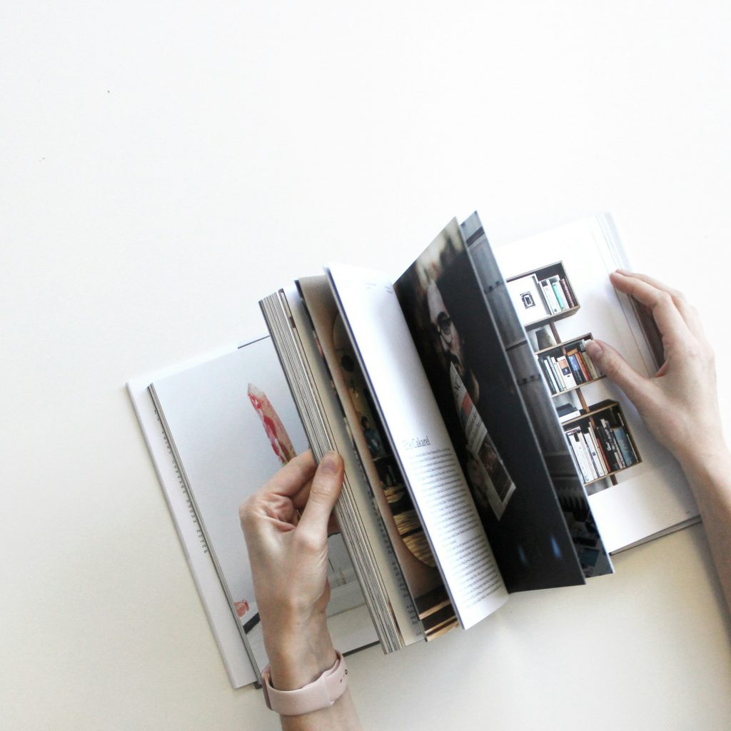 Flipping through pages of a book.